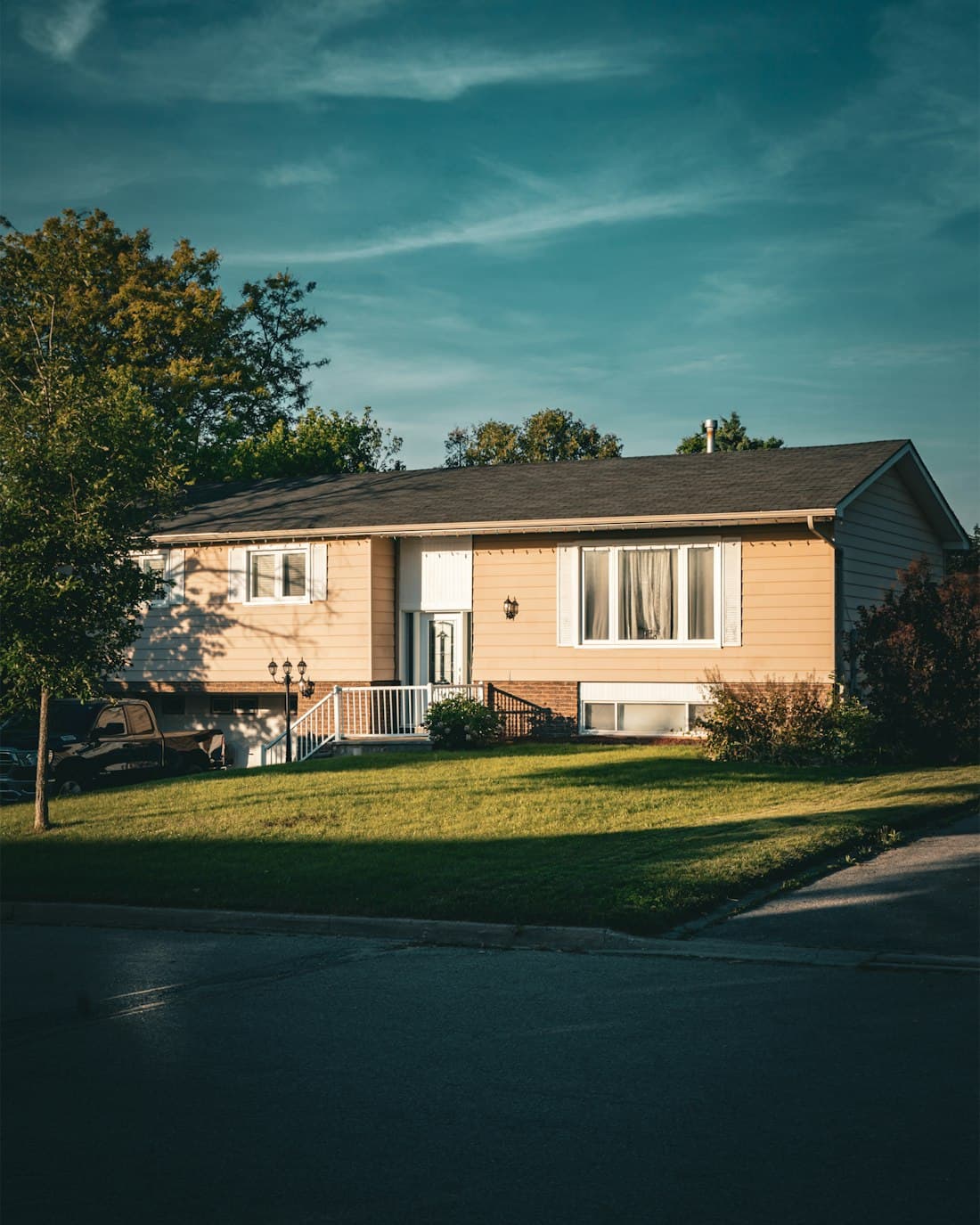 Single-storey ranch house in evening sun, bought as it stood
