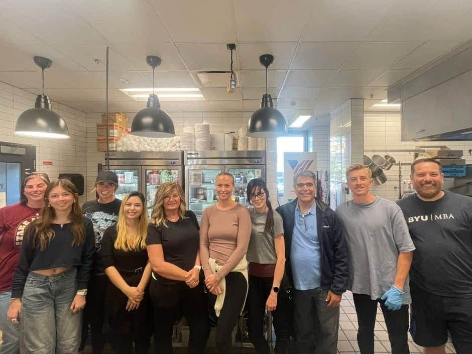 Property Seller Solutions team members standing together in a commercial kitchen